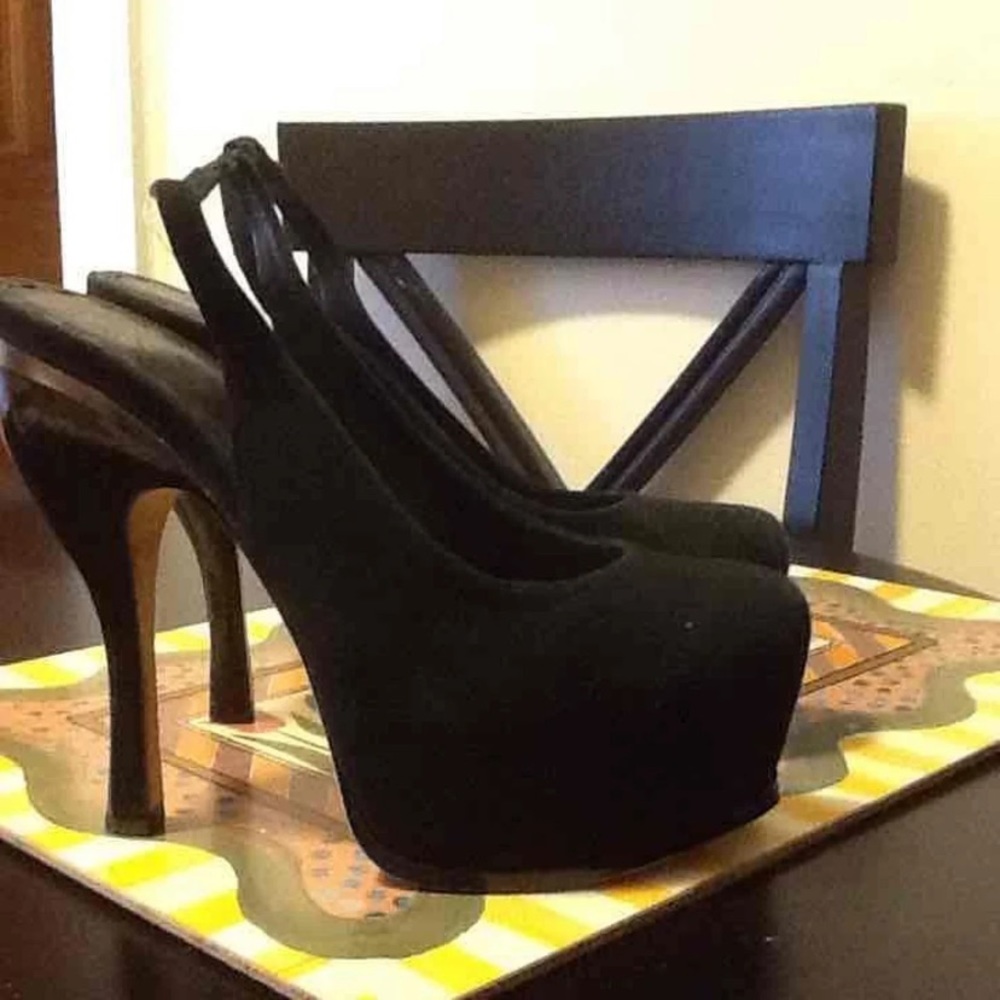 Black Slingback pumps .